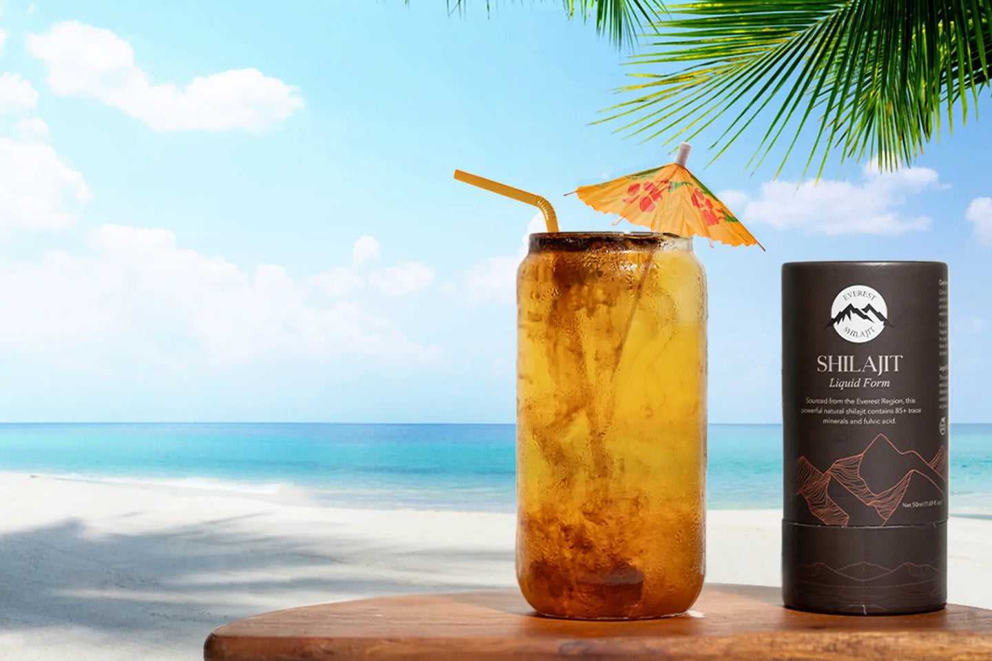 Shilajit resin in a glass jar beside a cooling summer drink