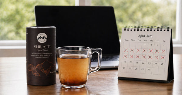 How Long Does It Take for Shilajit to Work – glass cup of shilajit drink beside Everest Shilajit packaging on a desk with laptop and April 2026 calendar showing marked days, clean natural workspace setup