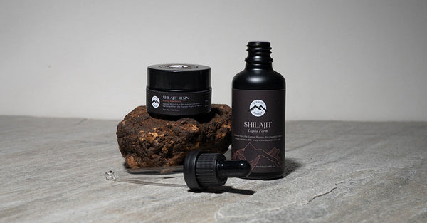 Shilajit resin jar and liquid shilajit bottle displayed on a stone surface, illustrating the topic Is There Zinc in Shilajit