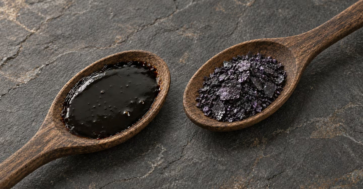 Shilajit resin and iodine crystals displayed in separate wooden spoons