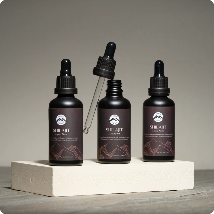 Everest Shilajit Liquid Form collection featuring three premium bottles with an open glass dropper for precise daily use.
