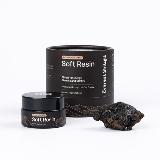 Everest Shilajit 30 g soft resin jar and packaging beside a piece of raw shilajit.
