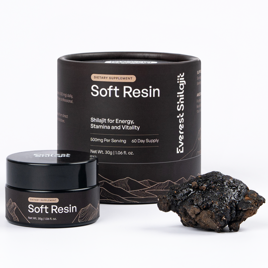 Everest Shilajit 30 g soft resin jar and packaging beside a piece of raw shilajit.