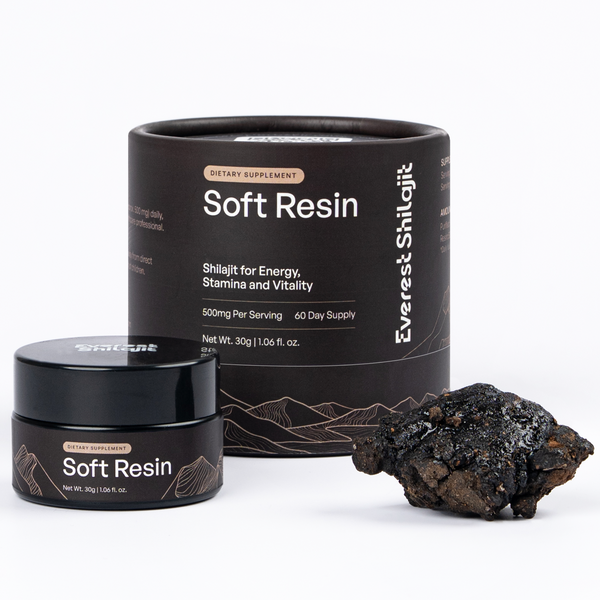 Everest Shilajit 30 g soft resin jar and packaging beside a piece of raw shilajit.