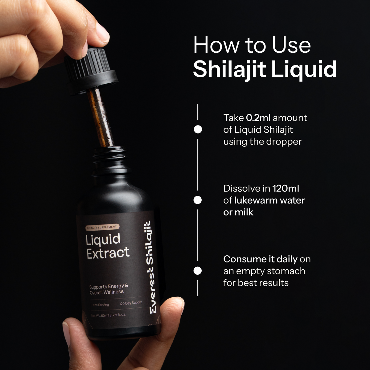 Hand lifting the dropper from an Everest Shilajit bottle beside instructions for using shilajit liquid drops.
